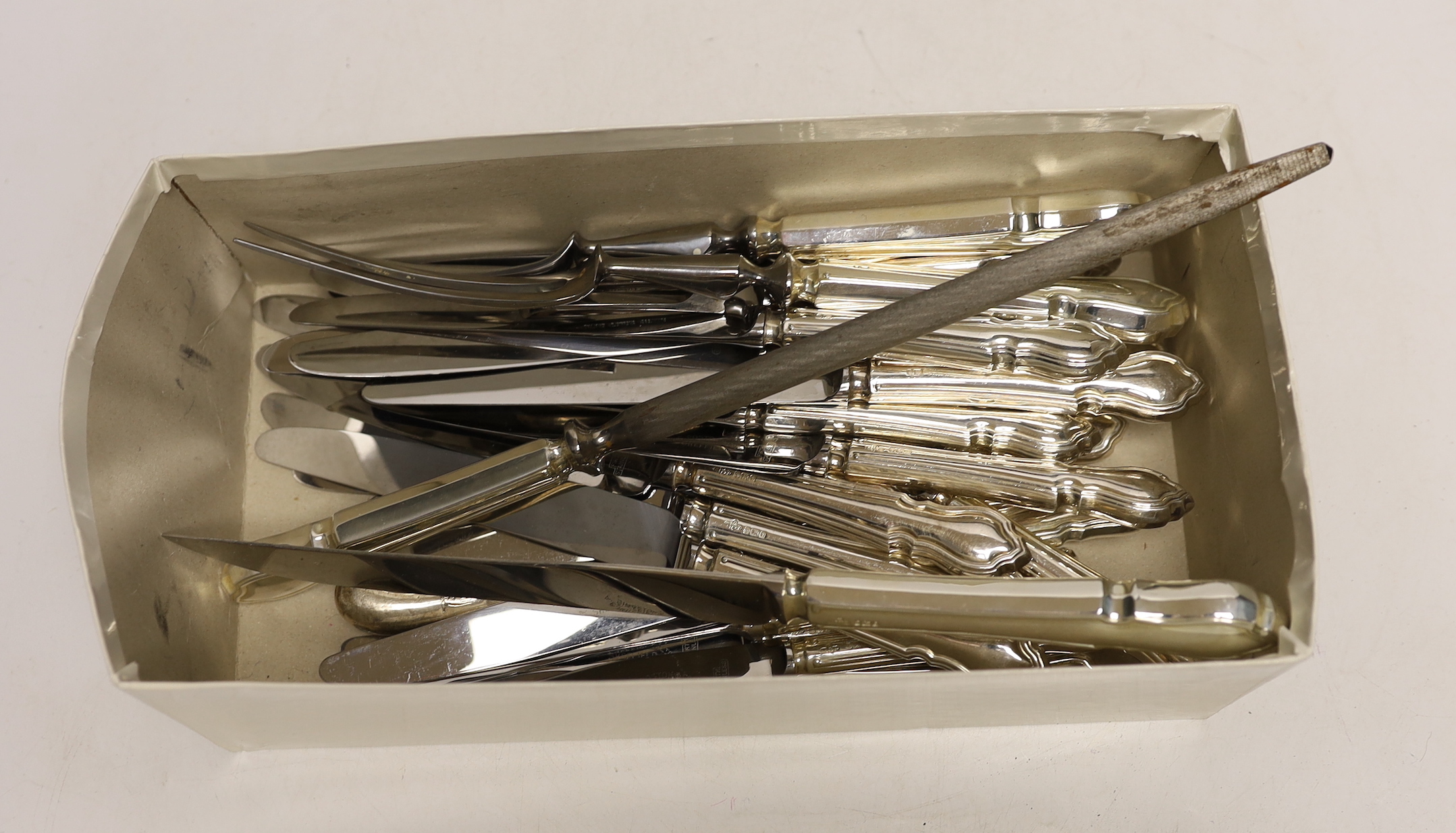 A set of twelve modern silver handled steel blade table knives, twelve matching dessert knives and a matching four piece carving set, A.E Poston & Co Ltd, Sheffield, 1978/9 and two odd silver pistol handles.